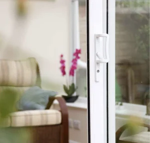 Handle and lock of a white uPVC patio sliding door